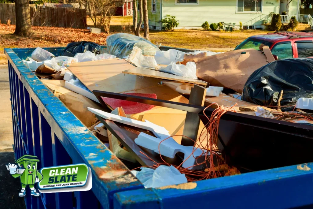 Dumpster filled with junk from a professional apartment cleanout in Vancouver, WA