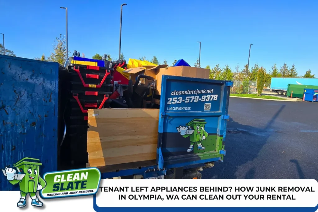 Dumpster full of appliances and junk left behind by a tenant at an Olympia rental